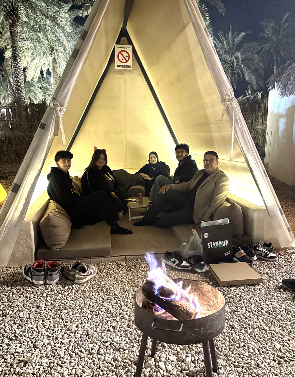 Malak Hassan and her family gathered in one of Dakkah Winter&rsquo;s intimate tents. (AN photo by Waad Hussain)